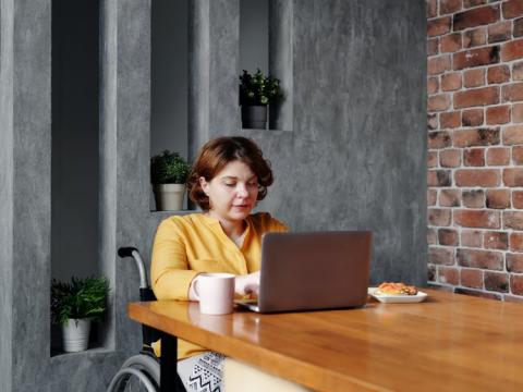 WFH Woman in wheelchair at desk