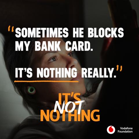 Person looking at phone in bed in shadow with text across reading 'Sometimes he blocks my bank card. It's nothing really' 'It's not nothing'.